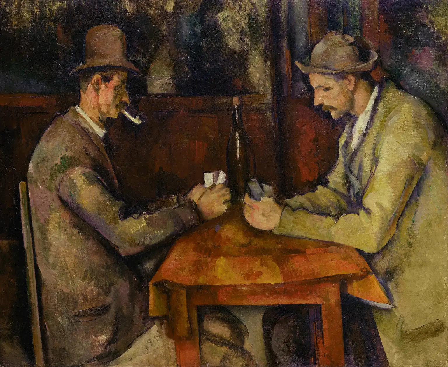 Men sitting around a table playing cards